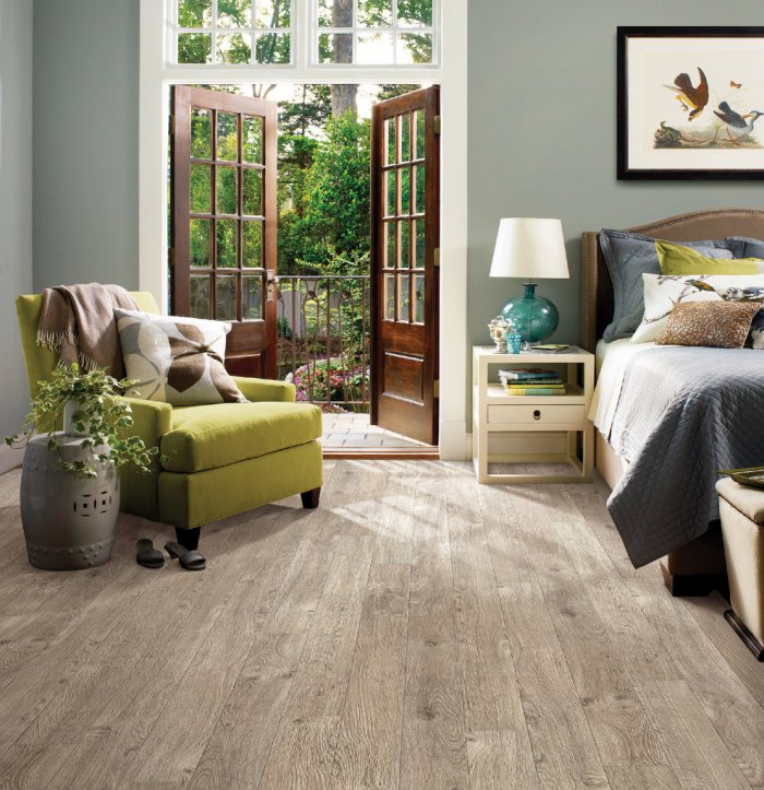 gray hardwood tile lookalike and green chair